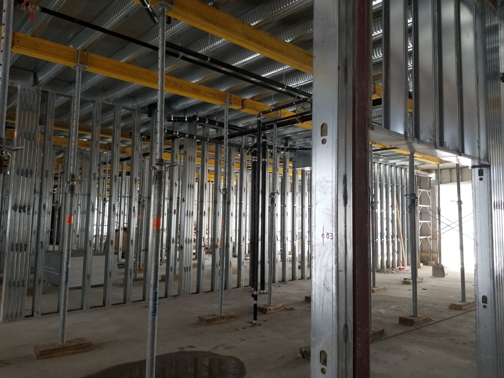 a room with steel framing and pipes